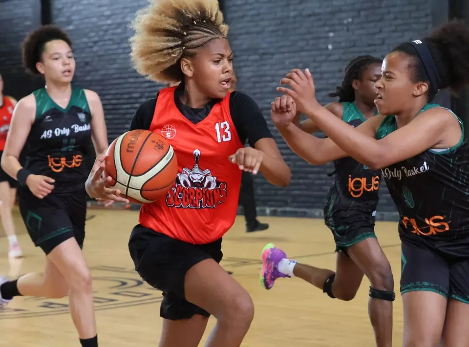 Basketball players in a duel during a match