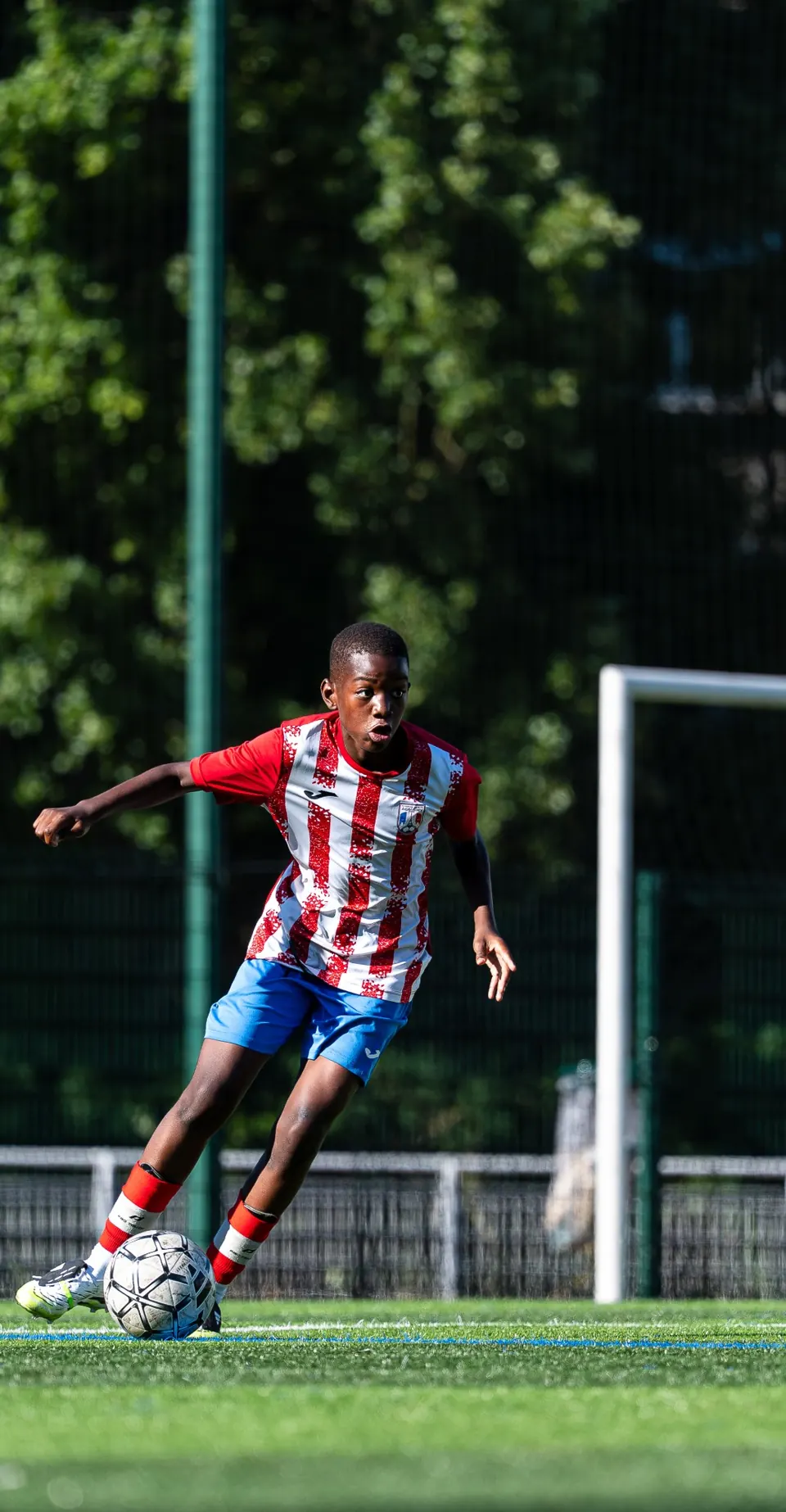 Young player dribbling the ball