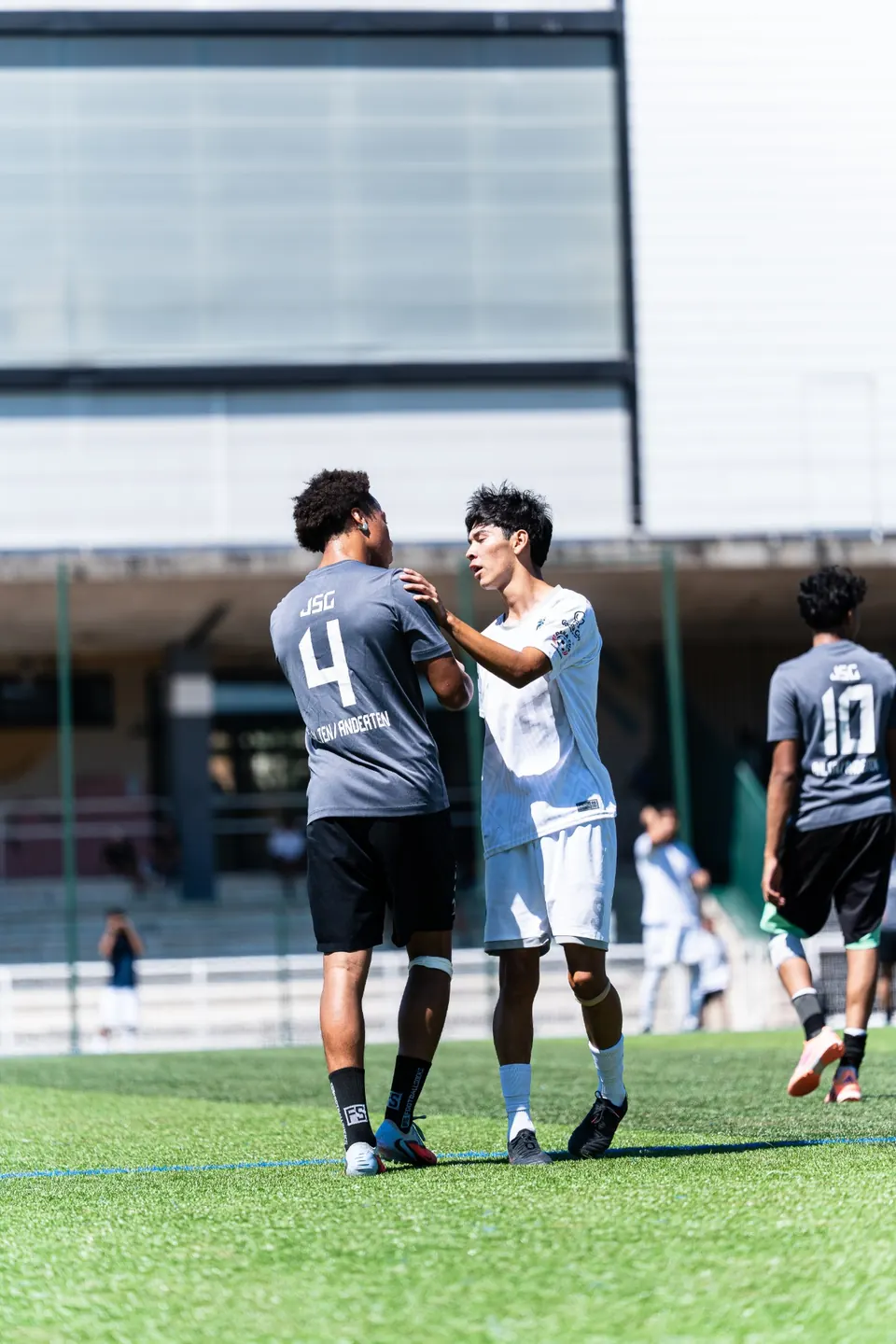 Players congratulating each other at the end of a match