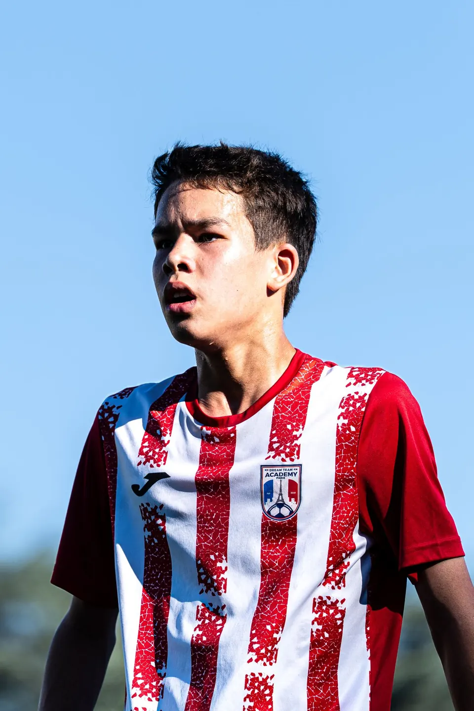 Portrait of a young player in a striped shirt