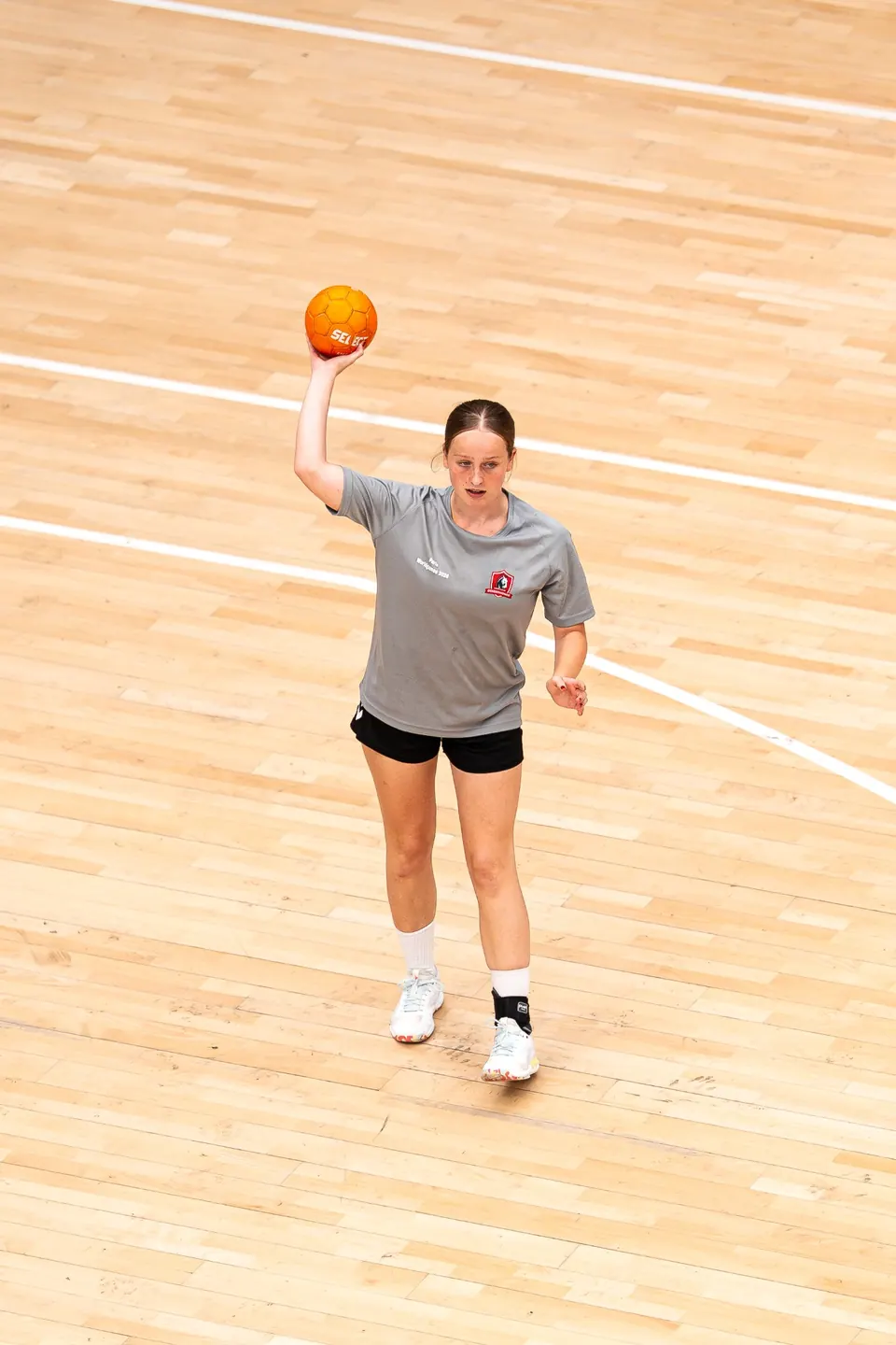Handball player preparing her shot